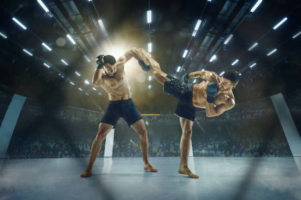 Two professional boxers boxing on the ring