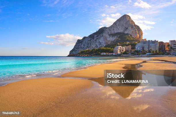 Playa De Fossa Beach In Calpe And Ifach Stock Photo - Download Image Now - Alicante, Beach, Calpe
