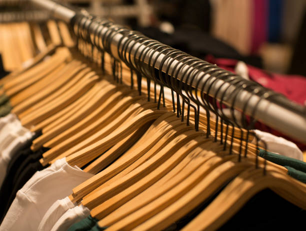 istock Hangers with different clothes in wardrobe closet 1146485614