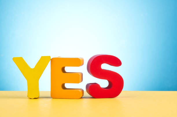istock motivation to be sincere and kind concept, word YES over beautiful reverberation gradient background 1146486021