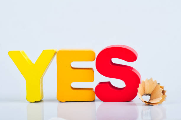 istock motivation to be sincere and kind concept, word YES on white reflection background 1146486042