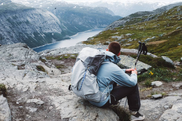 istock Man with backpack relaxing at the mountains in Norway 1146488130