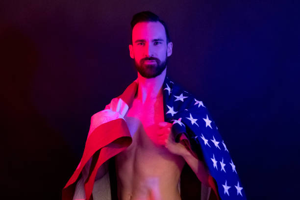 istock Handsome man holding an American flag 1146488271