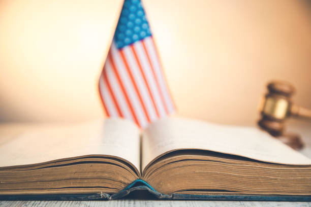 istock american flag with book and judge on desk 1146488392