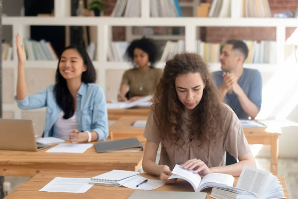 istock Diverse girls and guys students sitting in class during lecture 1146488490