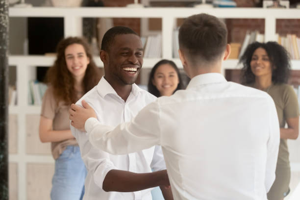 istock Diverse company head shake hands african employee during reward 1146488558