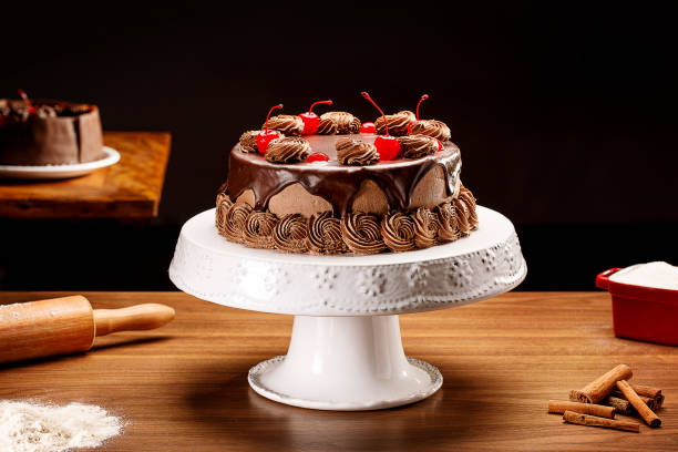 istock Chocolate cake with cherries on wooden background 1146488697