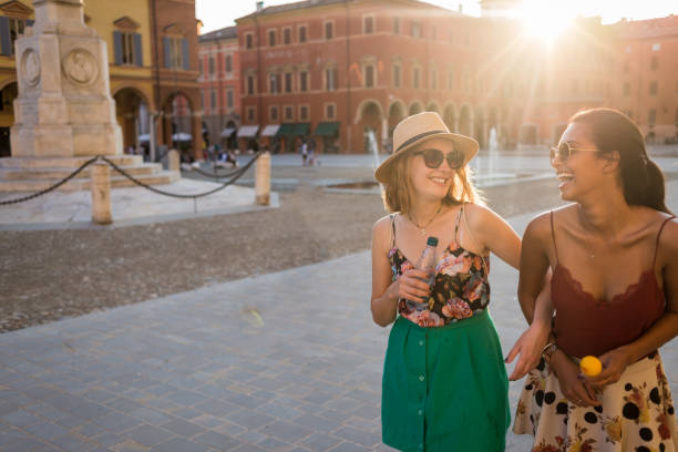istock friends having fun on a nice sunny day in the city 1146489175
