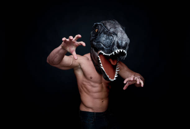 istock Sexy muscular man wearing a dinosaur mask 1146489804