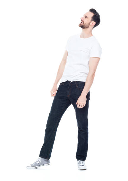istock Handsome man in white shirt and jeans 1146489967