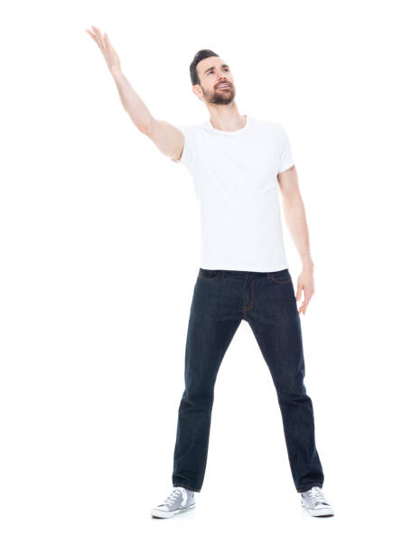 istock Handsome man in white shirt and jeans 1146490138
