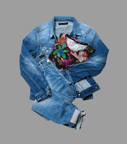 Denim trousers, made of jeans, folded neatly, fashion trends, isolated on a white background