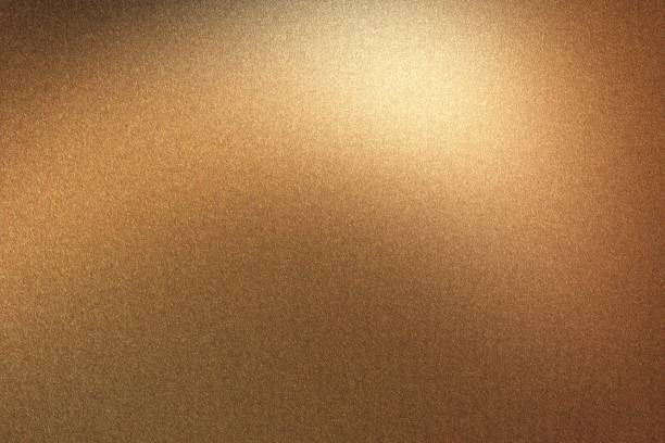 istock Glowing brushed bronze metal wall, abstract texture background 1146491600