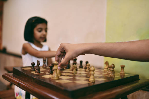 istock Brother and sister playing Chess 1146492168