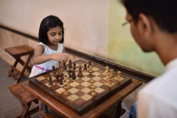 istock Brother and sister playing Chess 1146492284