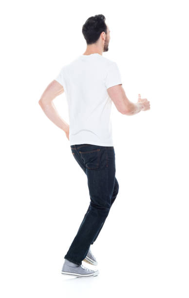 istock Handsome man in white shirt and jeans 1146493275