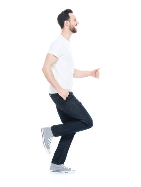 istock Handsome man in white shirt and jeans 1146494945