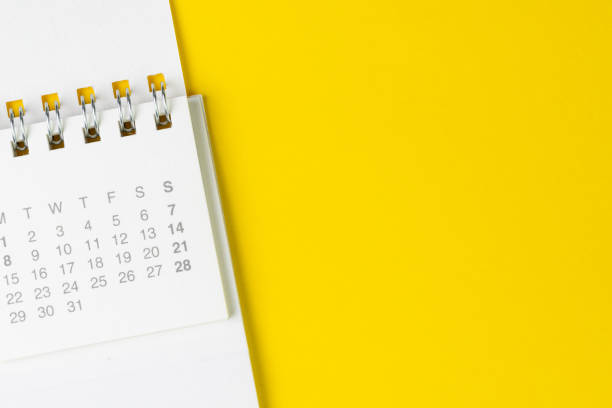 istock White clean calendar on solid yellow background with copy space, business, travel or project planning concept 1146495372