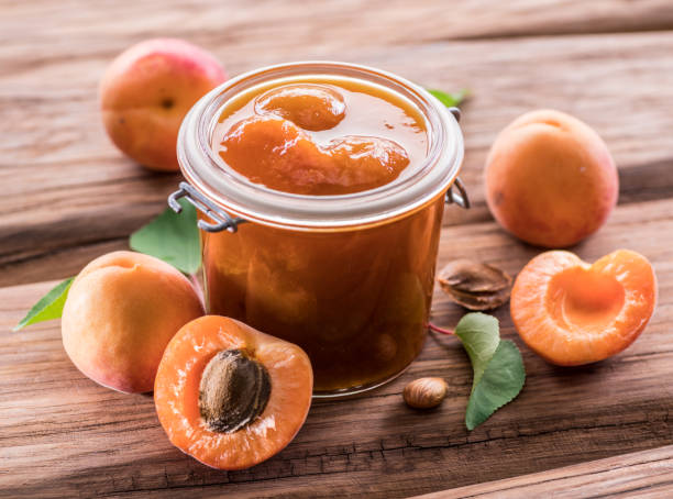 istock Apricot jam and ripe apricots. 1146496054