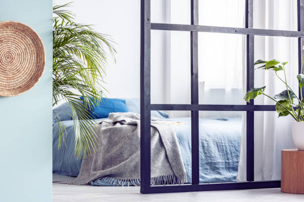istock Urban jungle in open plan trendy apartment interior with mullions wall 1146498557