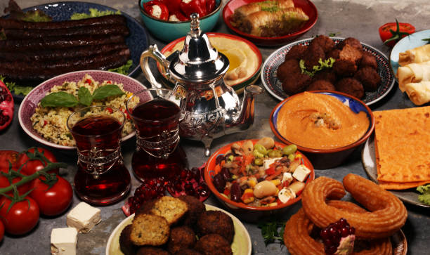 istock Middle eastern or arabic dishes and assorted meze, concrete rustic background. Falafel. Turkish Dessert Baklava with pistachio. Halal food. Lebanese cuisine 1146498676