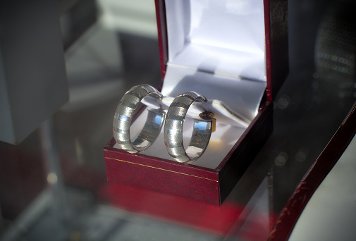 silver earrings in box jewelry store showcase