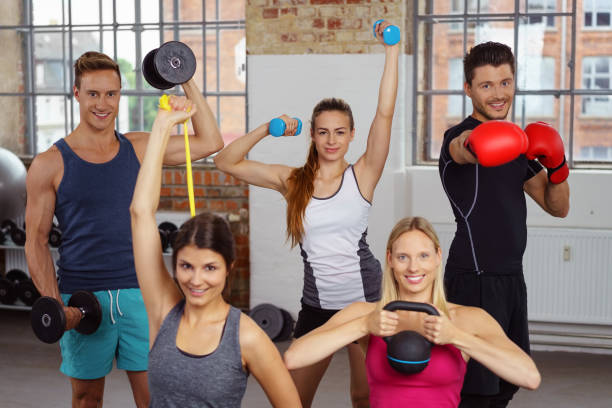 istock Five adults holding fitness training objects 1146504970