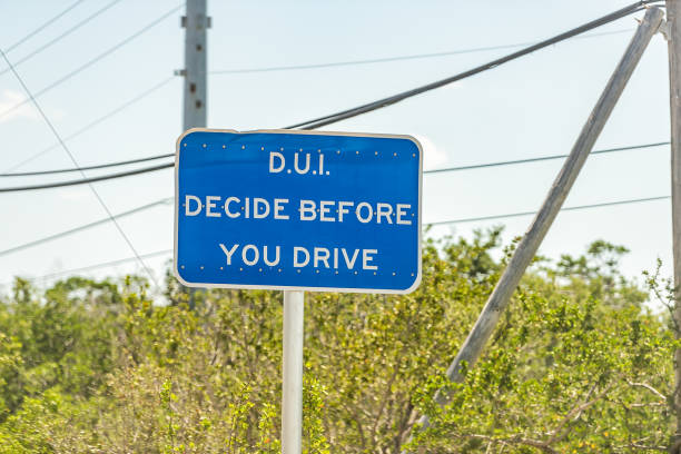 DUI blue sign on road and decide before you drive text in Islamorada, Florida Keys during day on street DUI blue sign on road and decide before you drive text in Islamorada, Florida Keys during day on street Overseas highway hurrican stock pictures, royalty-free photos & images