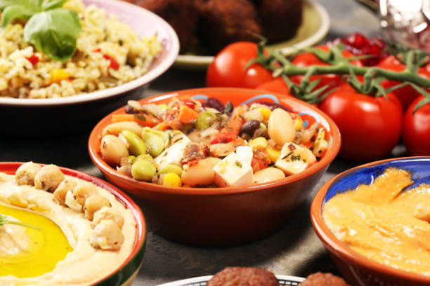 istock Middle eastern or arabic dishes and assorted meze, concrete rustic background. Falafel. Turkish Dessert Baklava with pistachio. Halal food. Lebanese cuisine 1146505366