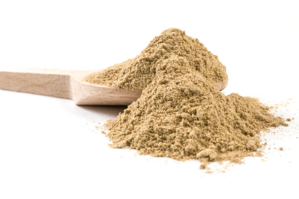istock cardamon powder on wooden spoon on white background 1146506948
