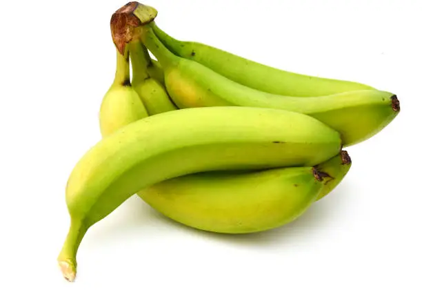 Photo of Green banana isolated on a white background