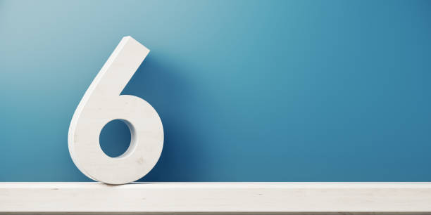 Number Six In Front Of Blue Wall Number six is standing in front of blue wall. Horizontal composition with copy space. number 6 photos stock pictures, royalty-free photos & images