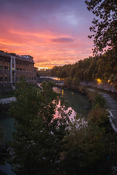 istock Glowing sunset over the river Tevere in Rome 1146510399
