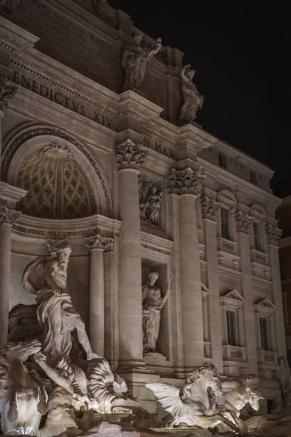 istock Neptune in the Trevi Fountain at night in Rome 1146510708
