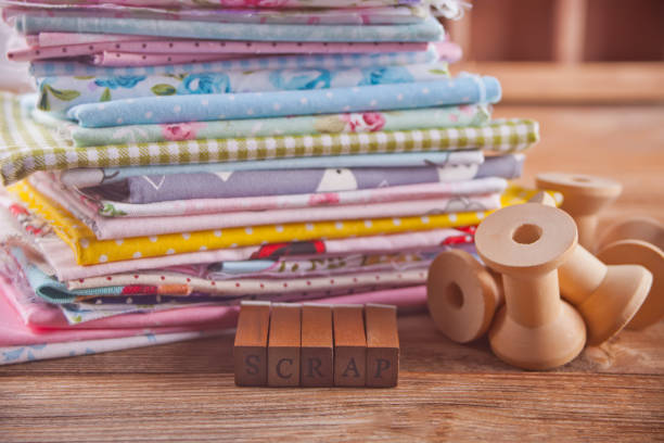 istock Scrapbooking wooden alphabet stamp with text Scrap and colorful cloth 1146510847