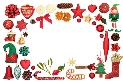 Decorative Christmas background border with festive bauble decorations and symbols on white background with copy space.