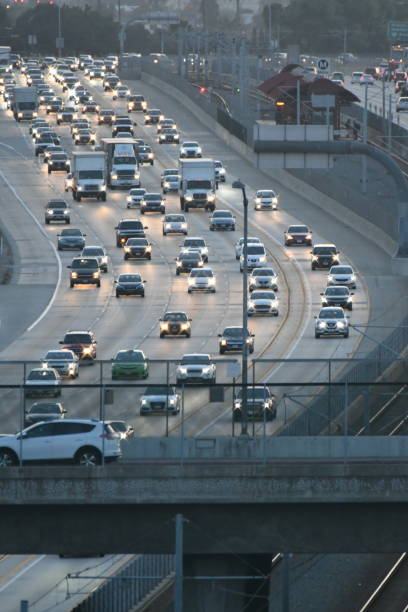 istock Cars on Freeway in Afternoon Light Vertical 1146512355