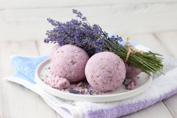 istock Handmade bath bombs and lavender on white planks 1146512765