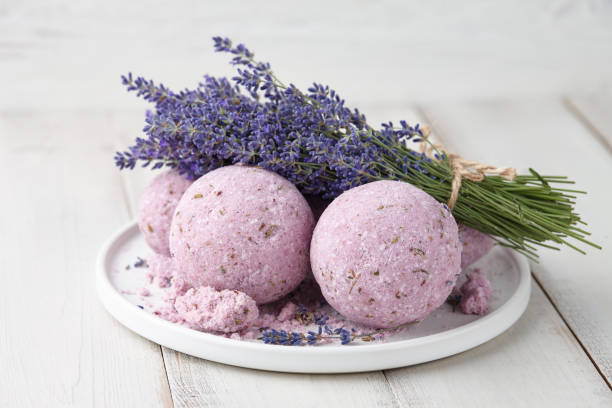istock Handmade bath bombs and lavender on white planks 1146512811
