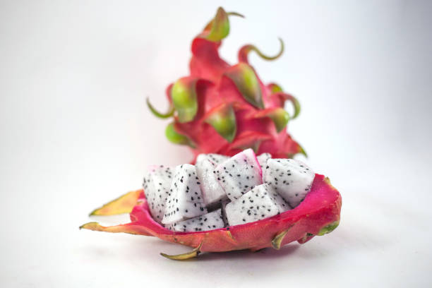 Exotic ripe white Pitaya or Dragon fruit. Red Pitahaya tropical fruit cut in cubes on white background