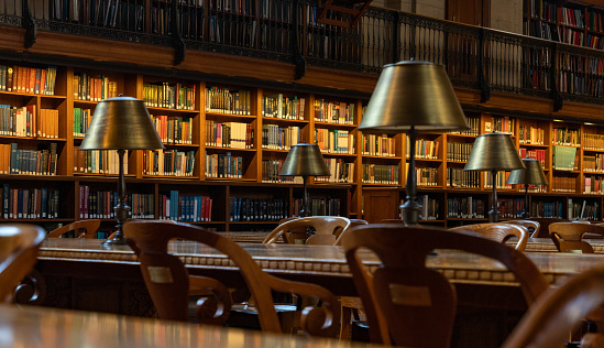 Interior of a college library with books and textbooks on bookshelves