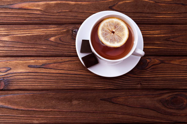istock A Cup of tea with lemon, two pieces of chocolate 1146518239
