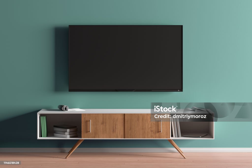 TV screen on the turquoise wall in modern living room TV screen on the turquoise wall in modern living room. 3d illustration Television Industry Stock Photo