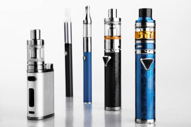 electronic cigarettes or vaping devices on white background modern electronic cigarettes or vaping devices on white background. Selective focus mod stock pictures, royalty-free photos & images