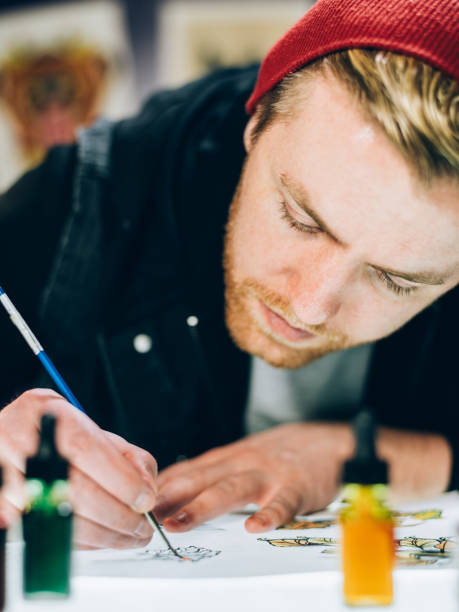 istock Tattoo artist drawing in his studio 1146520004