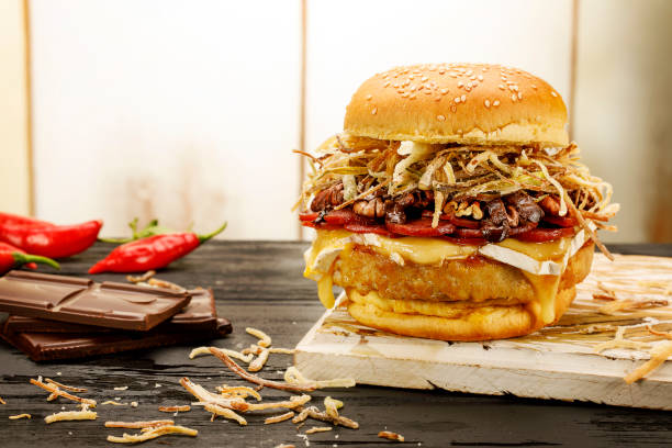 istock Handmade hamburger on wooden background with spices 1146520751