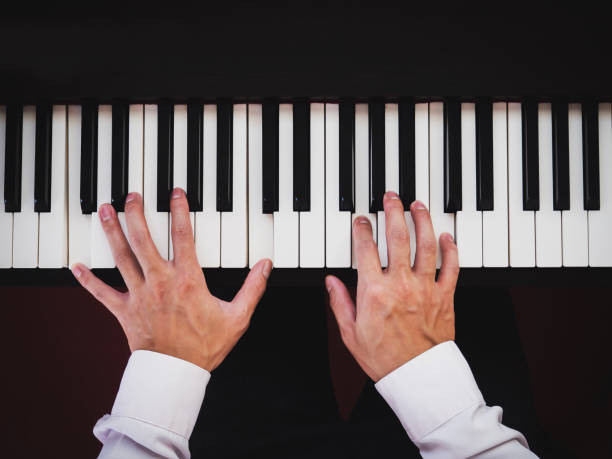 istock Hand man playing piano. Classical music instrument. Top view. 1146521004