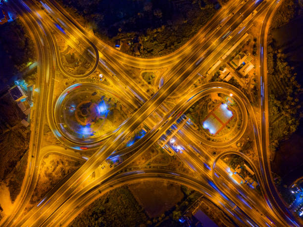 istock Aerial view of highway junctions. Bridge roads shape number 8 or infinity sign in structure of architecture concept. Top view. Urban city, Bangkok at night, Thailand. 1146522081