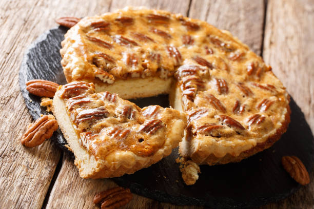 istock Delicious sliced American pecan pie close-up on the table. horizontal, rustic 1146526652