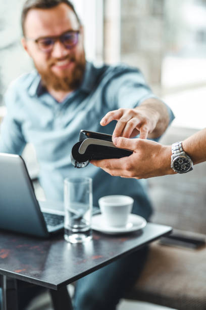 istock Handsome Businessman Paying With Credit Card 1146527951